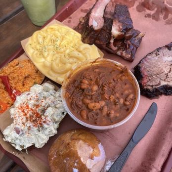 Terry Black's Barbecue - Mexican Rice Mac & Cheese Baked Potato Salad Pinto Beans Cornbread Sliced Brisket Pork Ribs - Barbeque Near Me - Austin, Texas Terry Black's Barbecue - Mexican Rice Mac & Cheese Baked Potato Salad Pinto Beans Cornbread Sliced Brisket Pork Ribs - Barbeque Near Me - Austin, Texas
