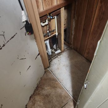 Nest Plumbing - This is the cramped little space they had to get into to do all the work this is my hall closet it normally has quite a few shelves in it. - Plumbing Near Me - Polk City, Florida