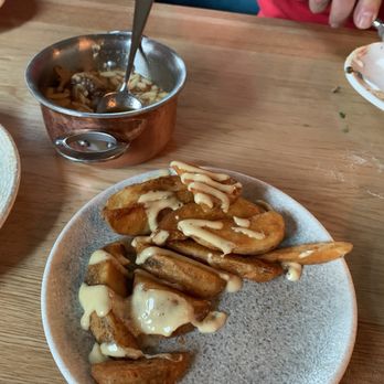 AMBAR Restaurant, Chicago - Roasted potatoes. Sauce was unique but tasty. Also, a goulash behind, which I did not sample. Sister said meat was a little tough. - Desserts Near Me - Chicago, Illinois