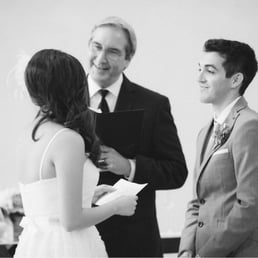 Dan at work during our wedding ceremony. He was an amazing officiant! Dan at work during our wedding ceremony. He was an amazing officiant!