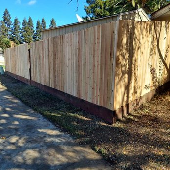 Kimesco - a wooden fence along a sidewalk - General Contractors Near Me - Herald, California Kimesco - a wooden fence along a sidewalk - General Contractors Near Me - Herald, California