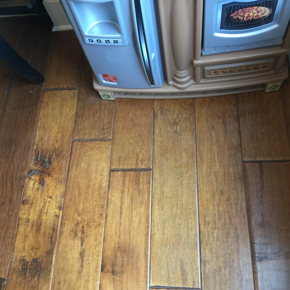 Blasingame Cleaning Services - corner of kitchen with playarea that wasn't touched, food was still on floor from days ago - Home Cleaning Near Me