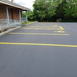 MC's Asphalt - Sealcoatin and new parking lines gives great curb appeal