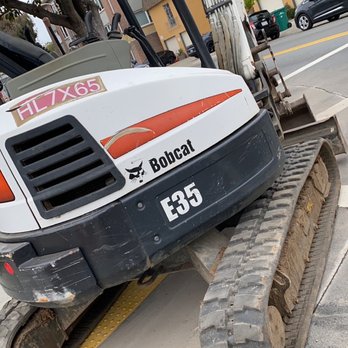 Villalobos & Associates - a bulldozer laying on the side of the road - General Contractors Near Me Villalobos & Associates - a bulldozer laying on the side of the road - General Contractors Near Me
