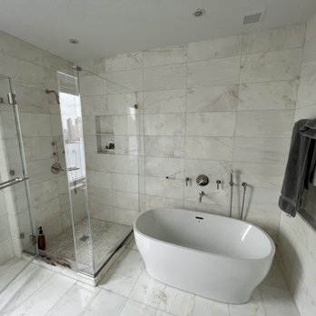 Bogdani Construction - a bathtub in a bathroom - Painters Near Me