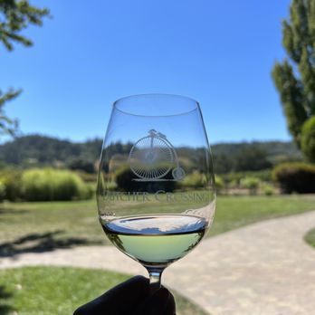 Dutcher Crossing Winery - a hand holding a wine glass - Wineries Near Me - Geyserville, California Dutcher Crossing Winery - a hand holding a wine glass - Wineries Near Me - Geyserville, California