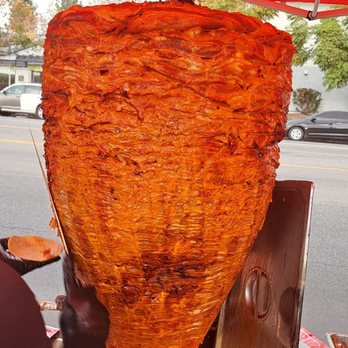 Tacos El Gorrion - a man preparing food - Tacos Near Me - Arleta, California