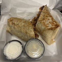 Mazatlan Family Mexican Restaurant - Burrito wrap La brava (ground beef, pineapple, chorizo) with black beans & rice inside- free side of sour cream & melted queso sauce