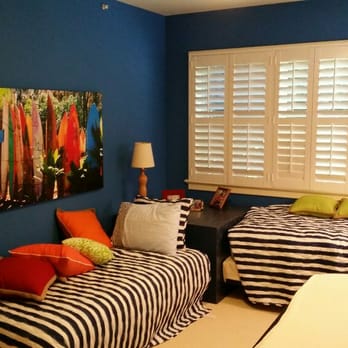 Will Paint - two beds in a room with blue walls - Painters Near Me Will Paint - two beds in a room with blue walls - Painters Near Me