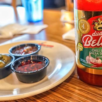 Noodle World - a bottle of bellito's chili sauce and three small bowls of olives - Chinese Near Me - Alhambra, California Noodle World - a bottle of bellito's chili sauce and three small bowls of olives - Chinese Near Me - Alhambra, California
