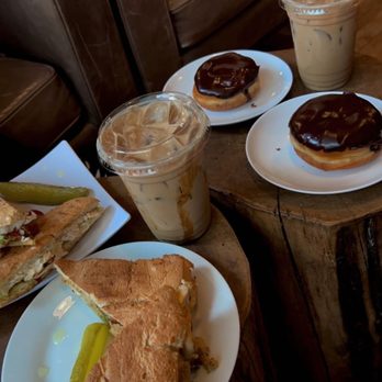 Coffee Tree - coffee, sandwiches and doughnuts on a table - Coffee & Tea Near Me - Seattle, Washington Coffee Tree - coffee, sandwiches and doughnuts on a table - Coffee & Tea Near Me - Seattle, Washington