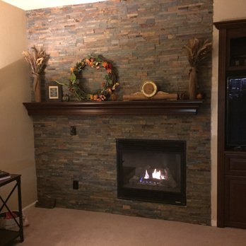 Tony Dumalag Constructors - a fireplace in a living room - General Contractors Near Me