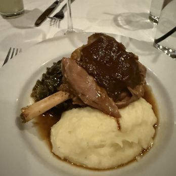 Saluda's - Lamb shank with mashed potatoes and collard greens - New American Near Me - Columbia, South Carolina Saluda's - Lamb shank with mashed potatoes and collard greens - New American Near Me - Columbia, South Carolina