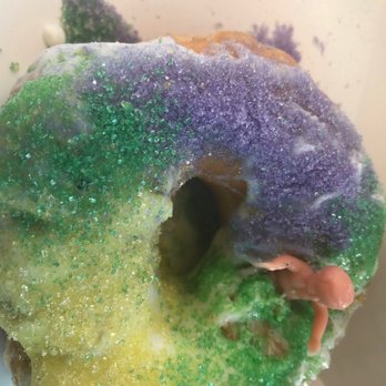 Donut King - Donut Mardi Gras donut with the baby. I stuck it in the icing so no complaints about the baby - Donuts Near Me - Minneola, Florida Donut King - Donut Mardi Gras donut with the baby. I stuck it in the icing so no complaints about the baby - Donuts Near Me - Minneola, Florida
