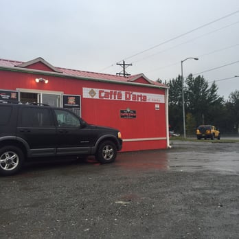 Caffé D'arte Alaska - a black suv parked in front of a red building - Coffee Roasteries Near Me - Anchorage, Alaska Caffé D'arte Alaska - a black suv parked in front of a red building - Coffee Roasteries Near Me - Anchorage, Alaska