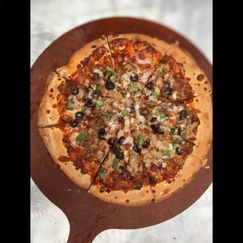 Home Run Pizza - a whole pizza on a wooden platter - Pizza Near Me - New Iberia, Louisiana Home Run Pizza - a whole pizza on a wooden platter - Pizza Near Me - New Iberia, Louisiana