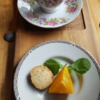 Doughgirls - “WESBROOK SUNRISE”- combination of milk chocolate and orange. Accompanied by an orange/almond sable and Cointreau-flavoured whipped cream - Cafes Near Me - Vancouver, British Columbia