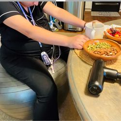 Wave's Embrace Doula Services - Laboring at home. TENS unit, massager, healthy snacks and her birth ball.