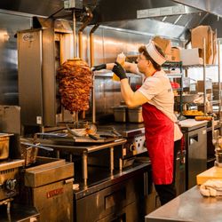 The Taco Stand - Employee cooking