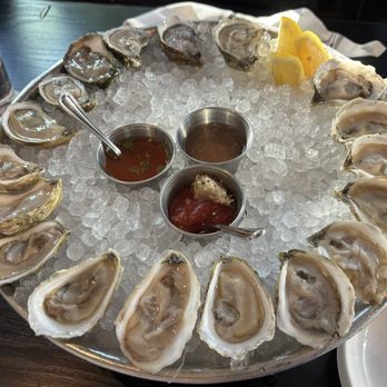 Row 34 - Clockwise from the lemon: 6 Island Creek, 6 Aunt Dotty, and 6 Wellfleet oysters. - Seafood Near Me - Burlington, Massachusetts Row 34 - Clockwise from the lemon: 6 Island Creek, 6 Aunt Dotty, and 6 Wellfleet oysters. - Seafood Near Me - Burlington, Massachusetts