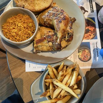 Nando's Peri-Peri - Chicken with garlic bread - Chicken Shop Near Me - Dunwoody, Georgia Nando's Peri-Peri - Chicken with garlic bread - Chicken Shop Near Me - Dunwoody, Georgia