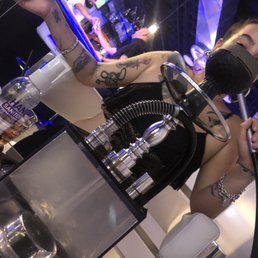 a woman sitting at a bar