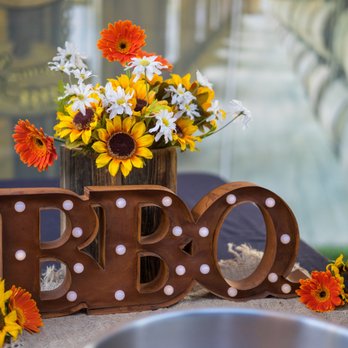 Gava D's BBQ - a vase of flowers on a table - Caterers Near Me - Temecula, California Gava D's BBQ - a vase of flowers on a table - Caterers Near Me - Temecula, California