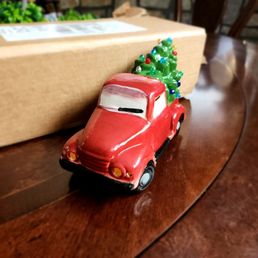 Antique truck with a Christmas tree on the back. Antique truck with a Christmas tree on the back.