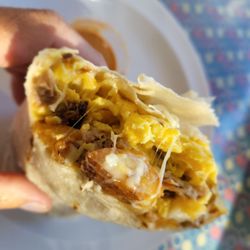 Brisket Breakfast Burrito with Eggs, Cheese, Brisket and Home style fries.