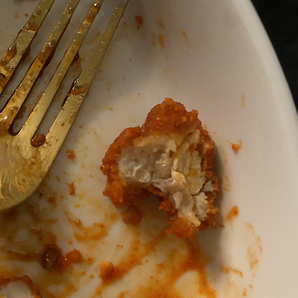 Wingstop - a half eaten piece of chicken on a plate with a fork - Chicken Wings Near Me - Houston, Texas Wingstop - a half eaten piece of chicken on a plate with a fork - Chicken Wings Near Me - Houston, Texas