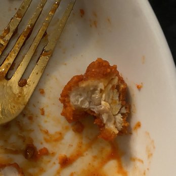 Wingstop - a half eaten piece of chicken on a plate with a fork - Chicken Wings Near Me - Houston, Texas Wingstop - a half eaten piece of chicken on a plate with a fork - Chicken Wings Near Me - Houston, Texas