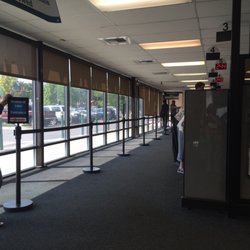 Department of Motor Vehicles - Individual directing customers to the right counter.