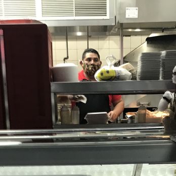 Chilcanos RestoBar - Food handler with improper mask wearing. His nose is hanging our. - Peruvian Near Me - Seven Corners, Virginia
