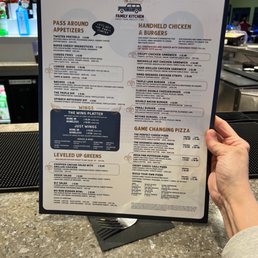 a person holding a menu a person holding a menu