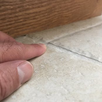 Calico Tile - One of many lifting, uneven tile. Not flush with its neighbors. - Tiling Near Me - Santa Maria, California