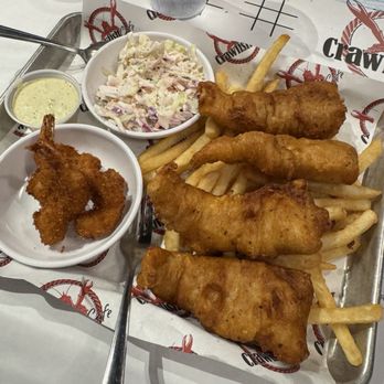 Crawfish Cafe - Overly greasy fish n Beer Battered Fish & Chips combo. - Seafood Near Me - Cypress, Texas