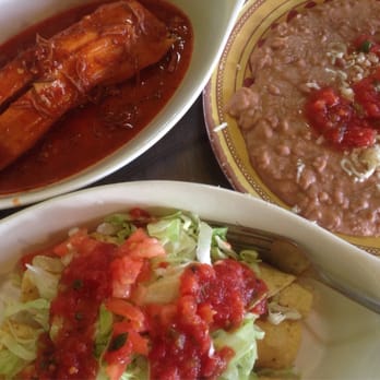 Tacos Mi Rancho - Clockwise from upper left: a beef tamale with red sauce, a side order of beans, and three rolled tacos with lettuce & tomatoes. - Mexican Near Me - Yuma, Arizona Tacos Mi Rancho - Clockwise from upper left: a beef tamale with red sauce, a side order of beans, and three rolled tacos with lettuce & tomatoes. - Mexican Near Me - Yuma, Arizona