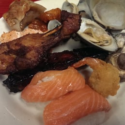 a plate of seafood and other foods