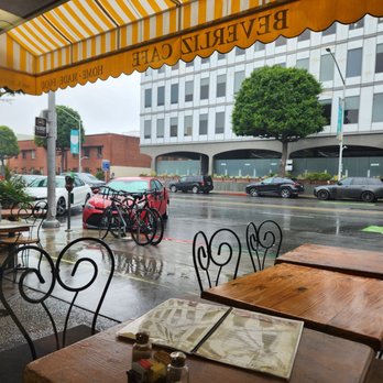 Beverliz Cafe - Sitting inside with a view of a not so busy street and rainy skies. - American Near Me - Beverly Hills, California