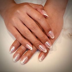 A natural nail gel manicure with French tips and chrome powder, done by Katie!