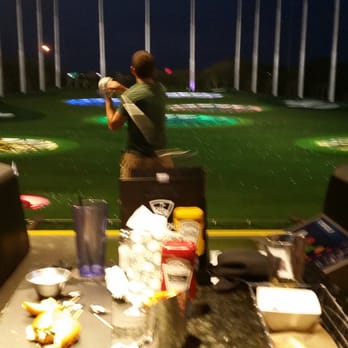 Topgolf - You have your own bay with table, chairs, tv, scoreboard, golf tee, and ball dispenser. Pretty awesome! - New American Near Me - Tampa, Florida Topgolf - You have your own bay with table, chairs, tv, scoreboard, golf tee, and ball dispenser. Pretty awesome! - New American Near Me - Tampa, Florida