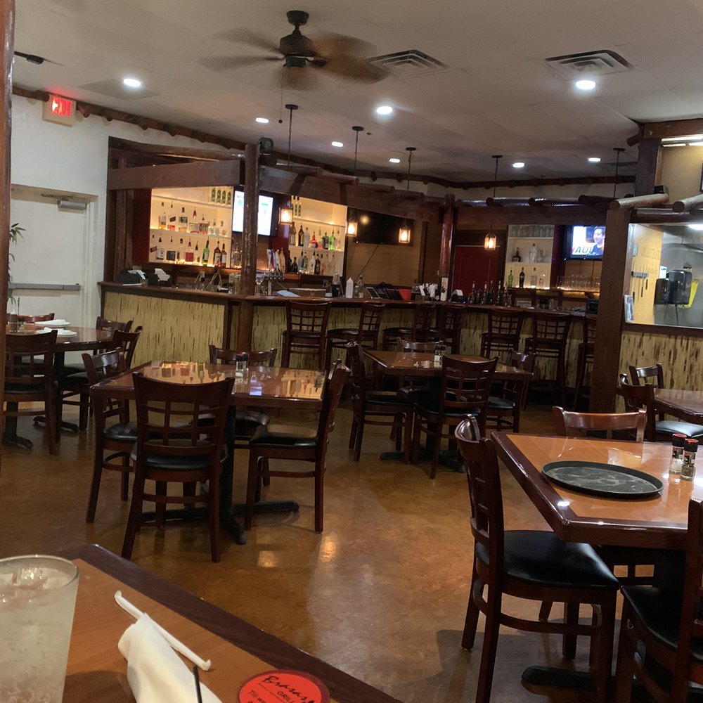 Brasas Grill - a restaurant with tables and chairs - Brazilian Near Me - Merritt Island, Florida Brasas Grill - a restaurant with tables and chairs - Brazilian Near Me - Merritt Island, Florida