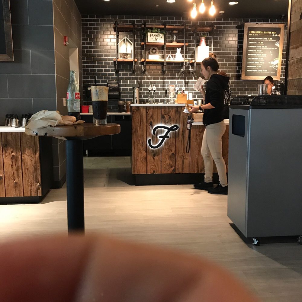 a person standing in a coffee shop