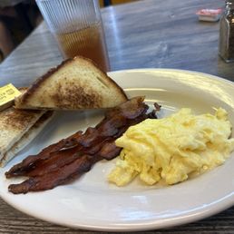 Eggs with cheese, bbq bacon, and toast