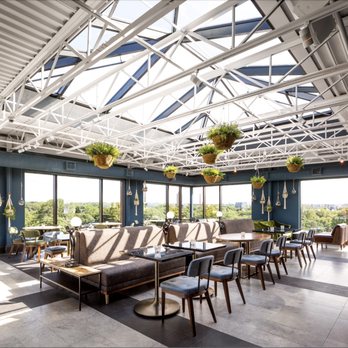 The Rooftop - a view of a dining room with a skylight - Cocktail Bars Near Me - Toronto, Ontario