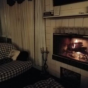 Manor on Golden Pond - Norfolk Suite fireplace by night - Hotels Near Me - Holderness, New Hampshire