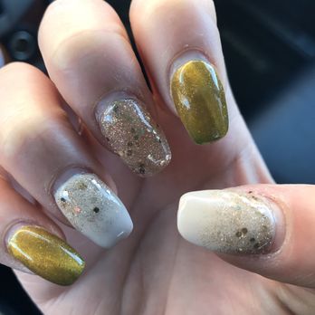 ARI Nails - Day 21! Nails are warm, displaying the golden yellow color - Nail Salons Near Me - Northfield, Minnesota