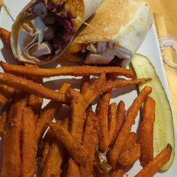 Chicken, bacon, cheddar, and ranch wrap with sweet potato fries