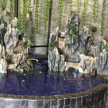 Grand Buffet - a waterfall in the middle of a pool - Buffets Near Me - Bradenton, Florida
