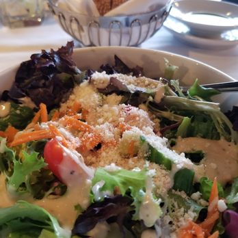 Andiamo - House salad with complimentary bread basket in the background - Italian Near Me - Detroit, Michigan